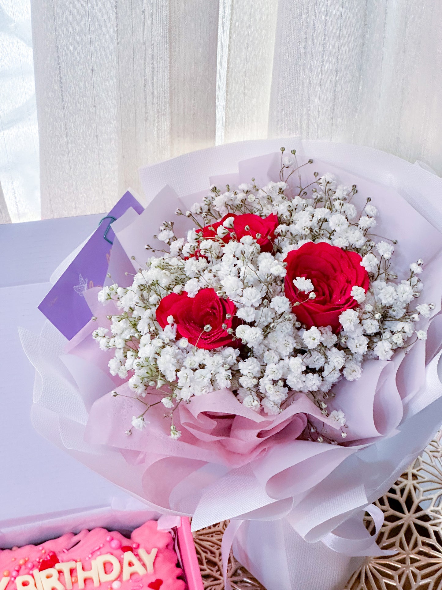 3 stalk red roses with white baby breath