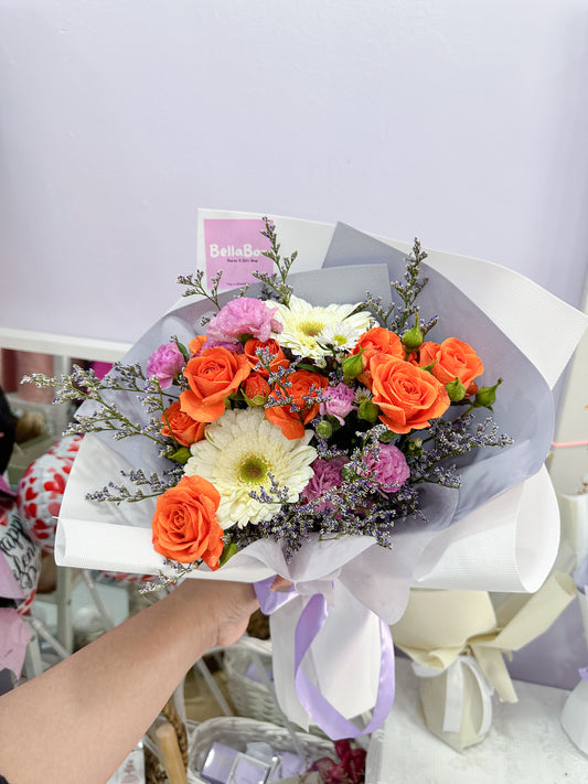 fresh orange roses, white daisy,purple carnation & caspia