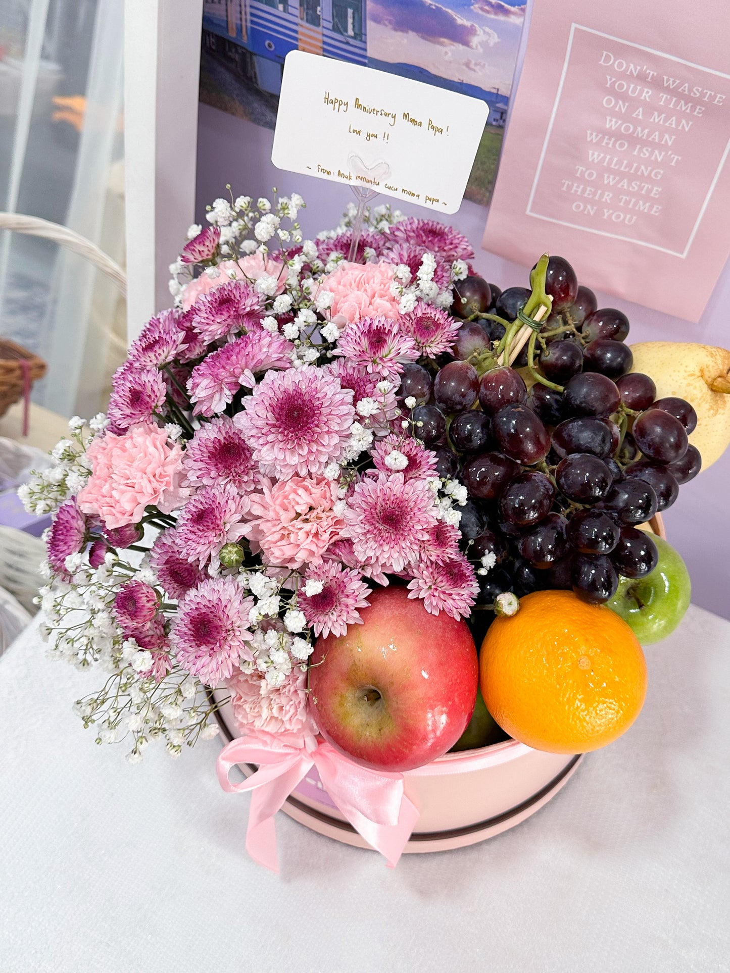 Fruits box with flowers arrangement