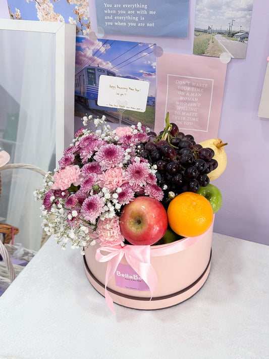 Fruits box with flowers arrangement