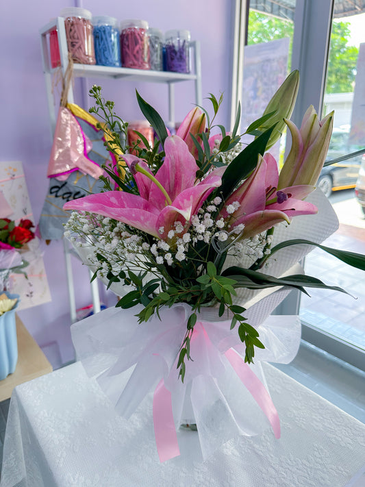 Pink Lily with baby breath, Eucalayptus in vaseu