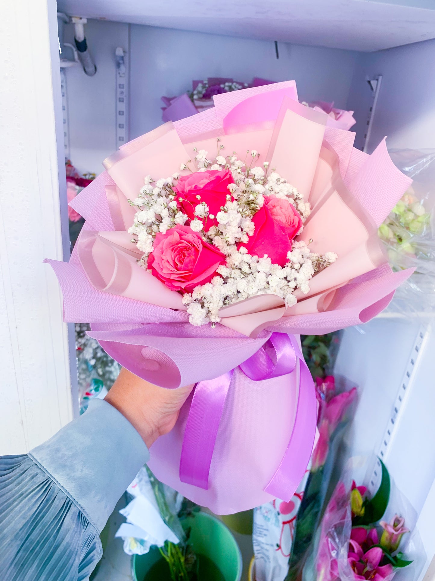 Hot pink Rose with white baby breath