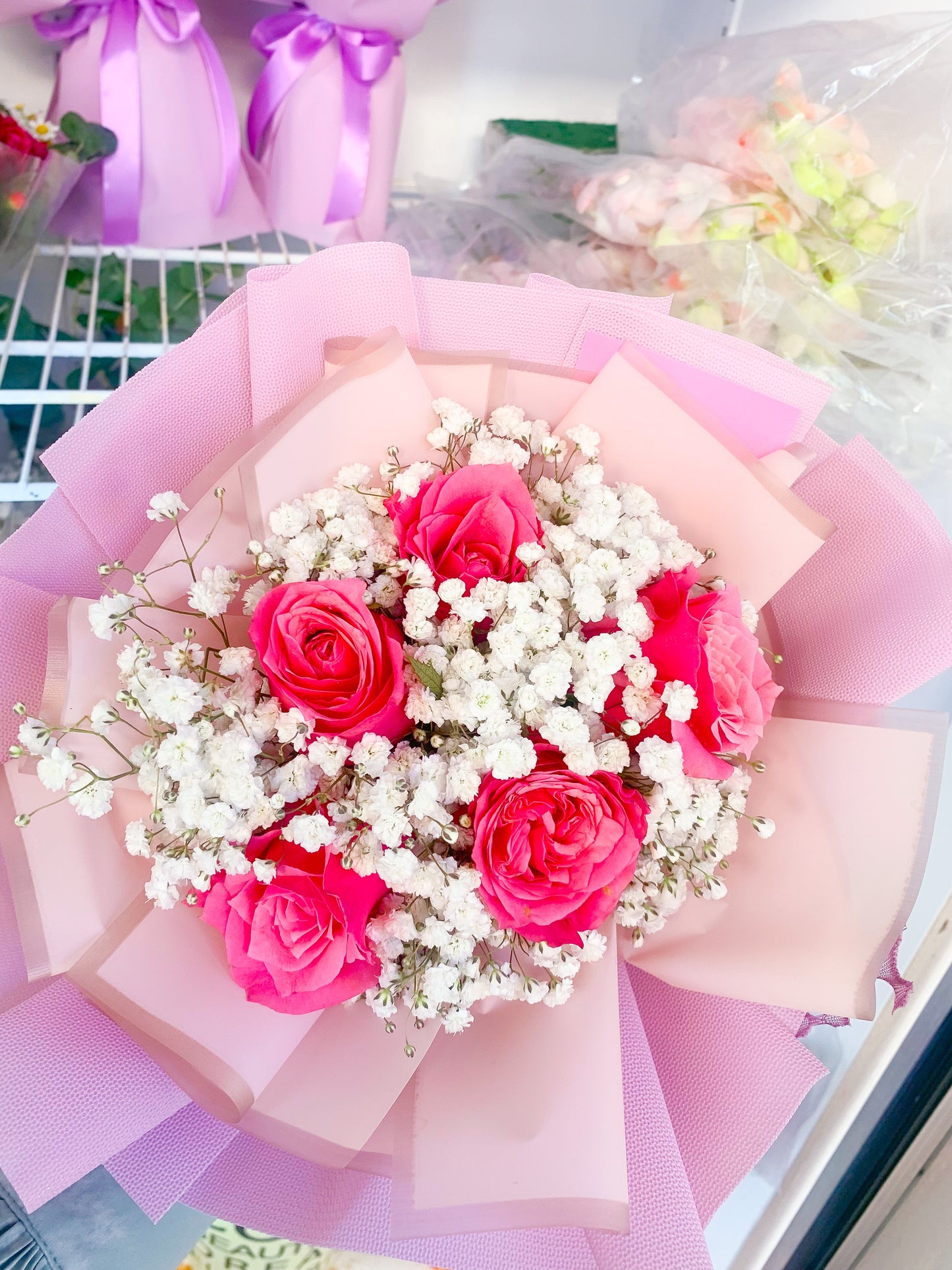 Hot pink Rose with white baby breath