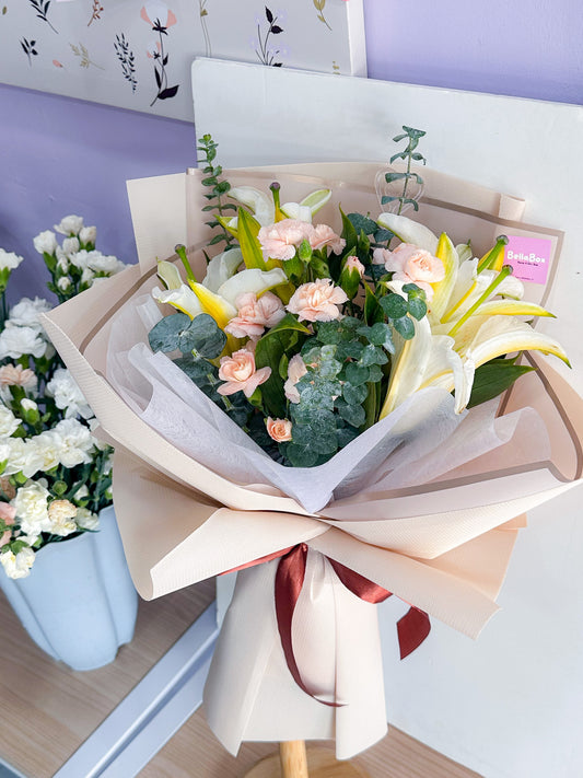 White lily with peach carnations & eucalayptus