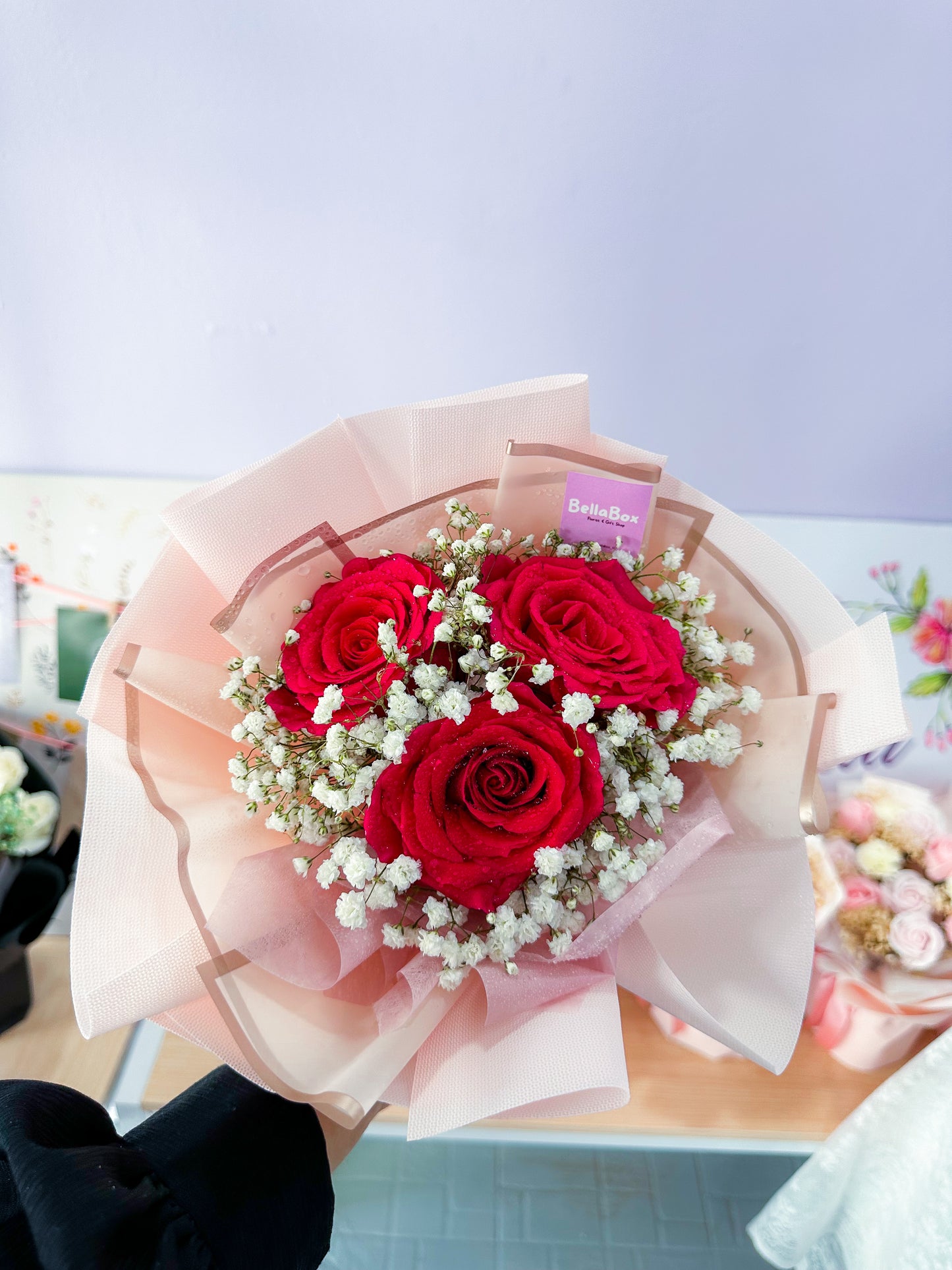 3 stalk red roses with white baby breath