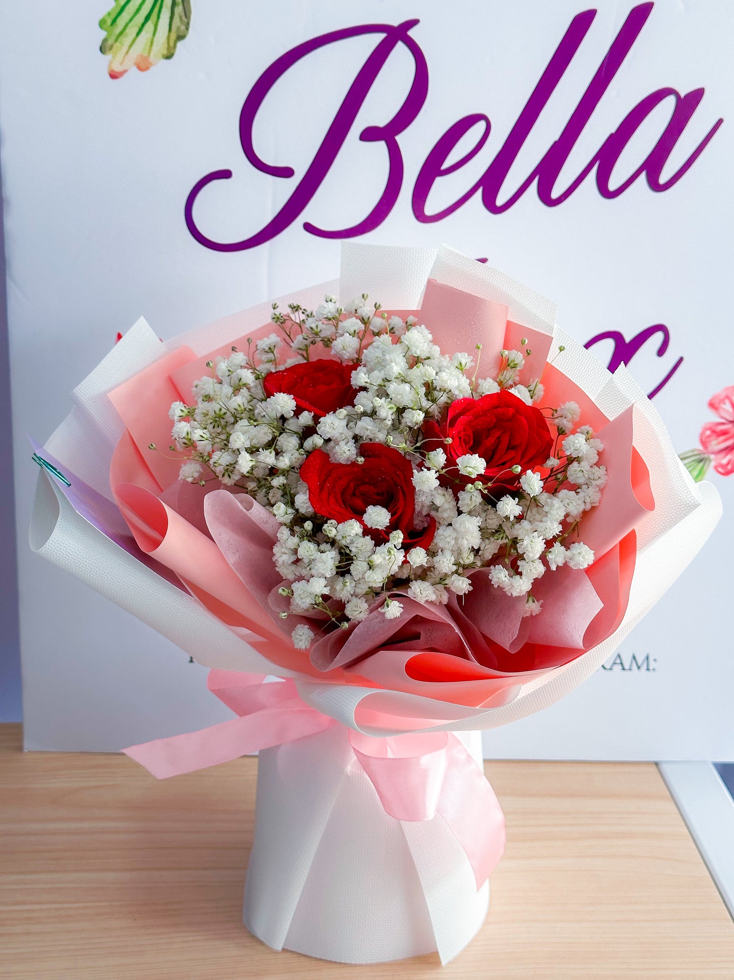 3 stalk red roses with white baby breath